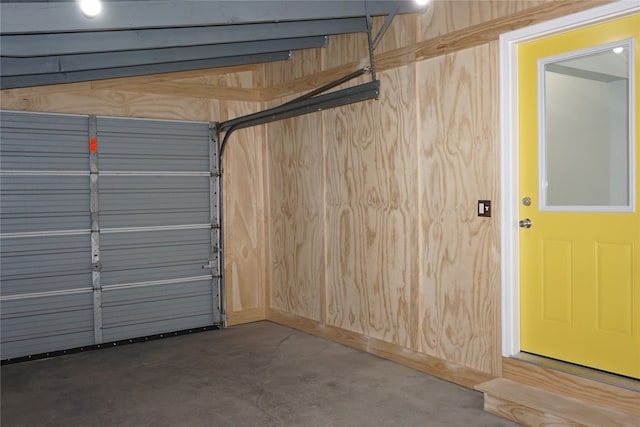 garage featuring wooden walls