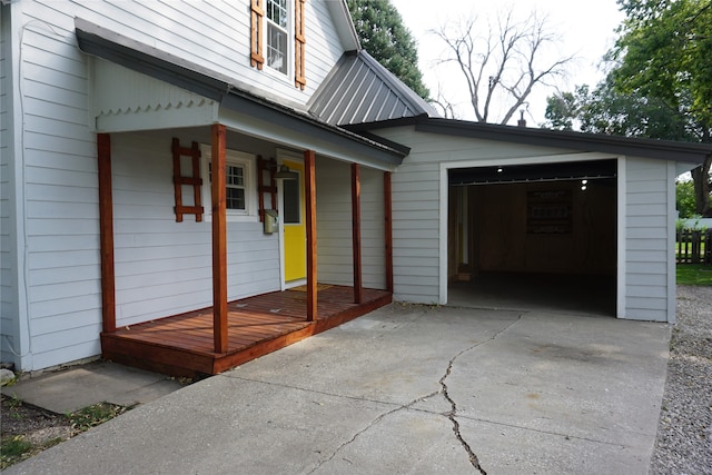 exterior space featuring a garage and covered porch