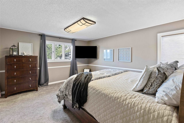 carpeted bedroom with a textured ceiling