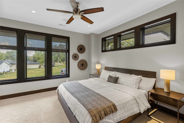 bedroom with ceiling fan and carpet flooring