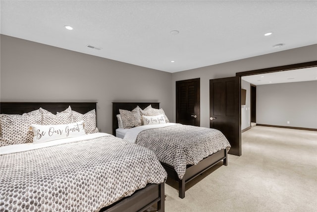 carpeted bedroom with a textured ceiling