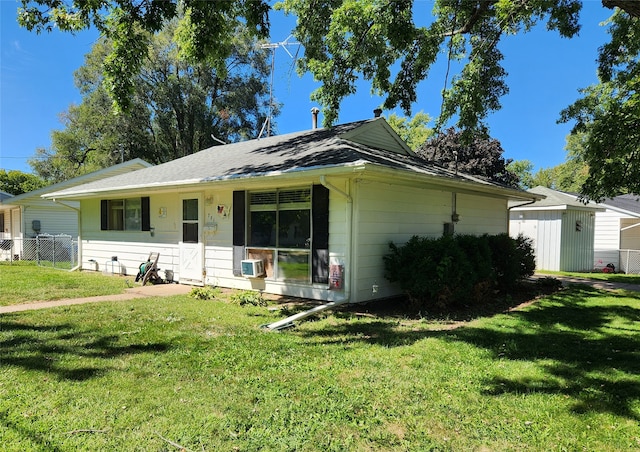 single story home featuring a front yard