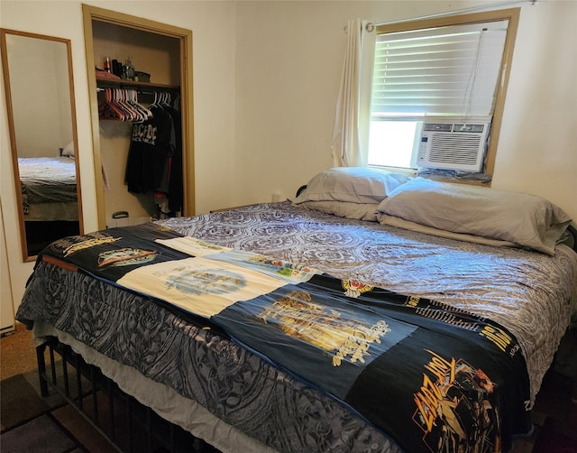 carpeted bedroom featuring a walk in closet, a closet, and cooling unit