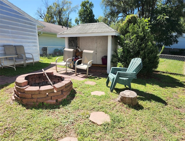 view of yard with an outdoor fire pit