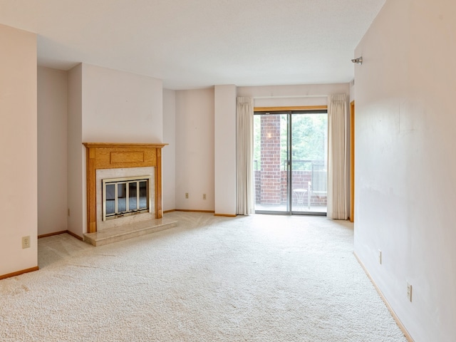 unfurnished living room featuring carpet flooring