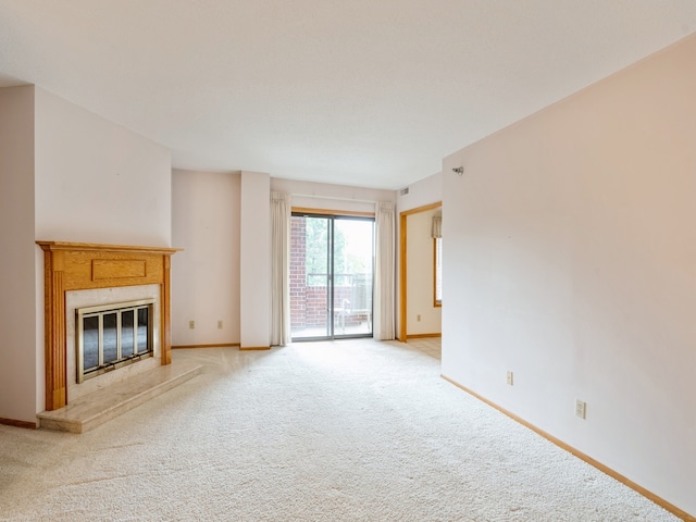 unfurnished living room with light colored carpet