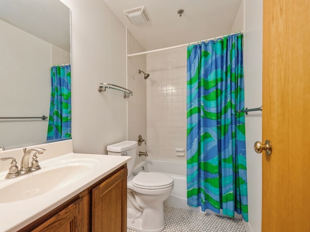 full bathroom with tile patterned floors, toilet, shower / tub combo with curtain, and vanity