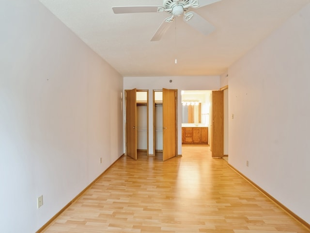 unfurnished bedroom with ceiling fan and light hardwood / wood-style flooring