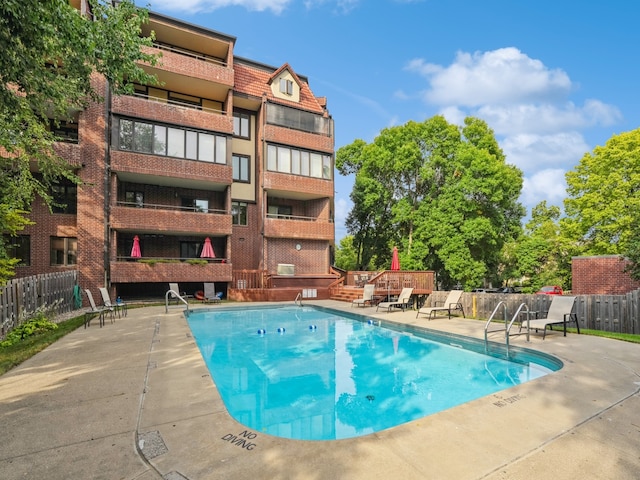 view of pool featuring a patio