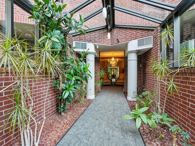 entrance to property featuring a patio area