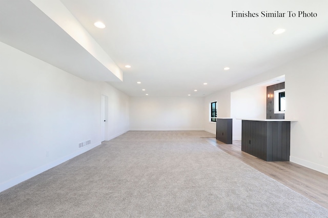 spare room featuring light hardwood / wood-style floors