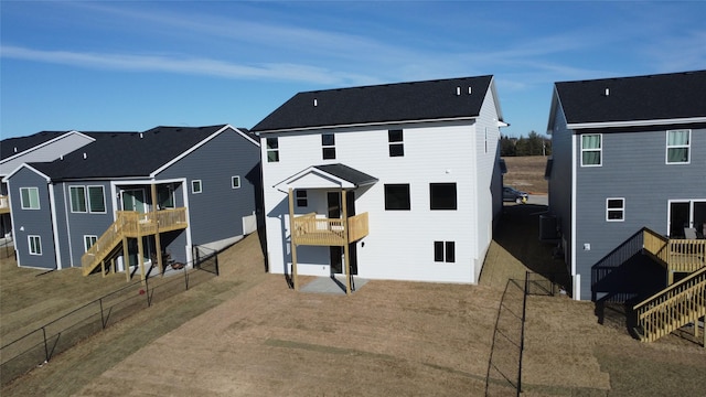 rear view of house with central AC