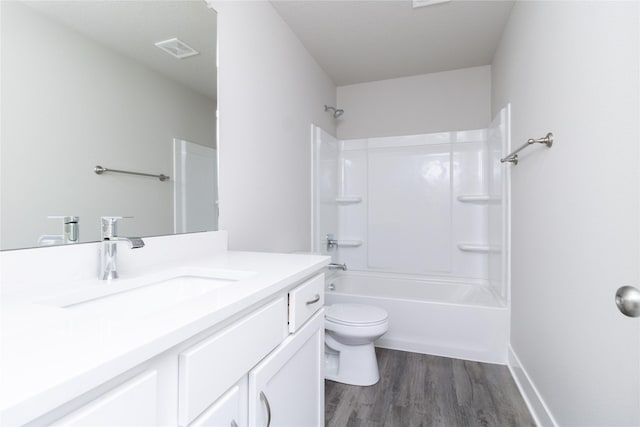 full bathroom featuring hardwood / wood-style flooring, shower / bathtub combination, vanity, and toilet