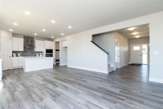 unfurnished living room featuring light wood-type flooring