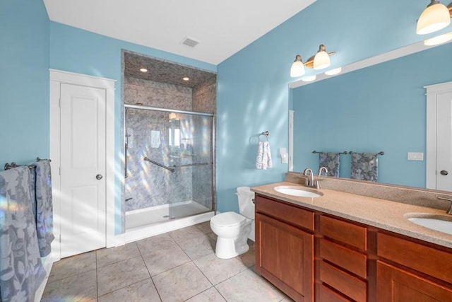 full bath featuring double vanity, a sink, and a shower stall