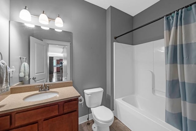 full bath featuring baseboards, toilet, tile patterned floors, shower / bath combination with curtain, and vanity