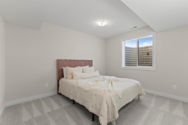 bedroom featuring light carpet