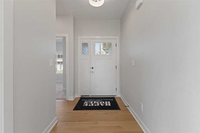 foyer with light hardwood / wood-style flooring