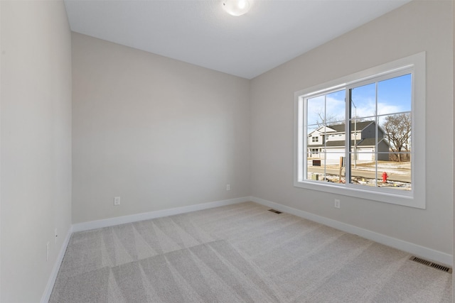 1028 2nd St NE, Altoona, IA 50009 - spare room with carpet flooring and baseboards
