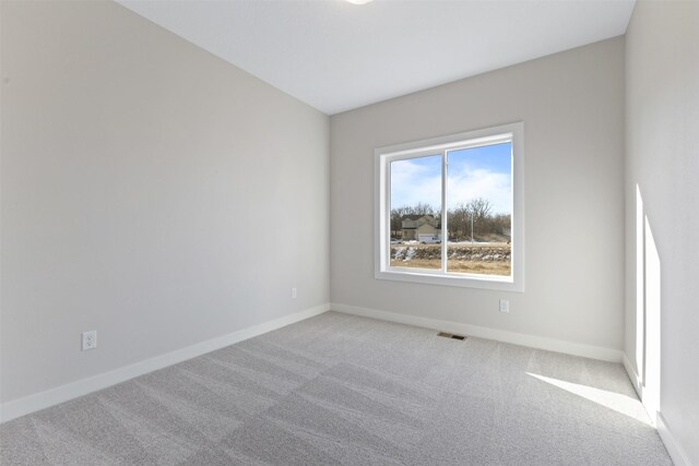 empty room featuring carpet flooring