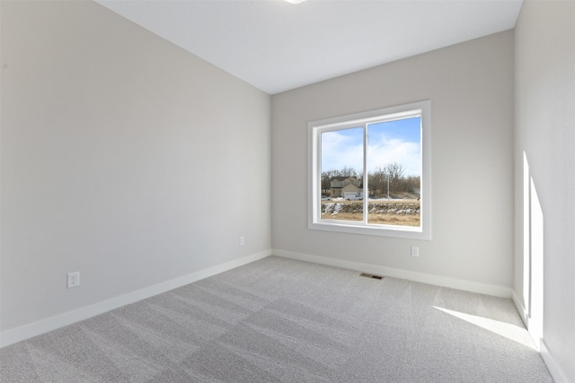 unfurnished room with carpet floors