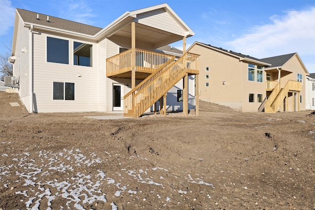 back of house featuring central AC unit