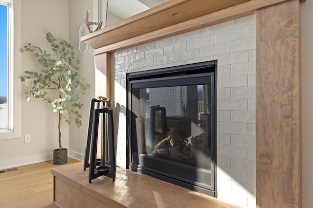 1028 2nd St NE, Altoona, IA 50009 - detailed view of wood finished floors and a fireplace