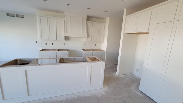 kitchen featuring white cabinetry and a kitchen island