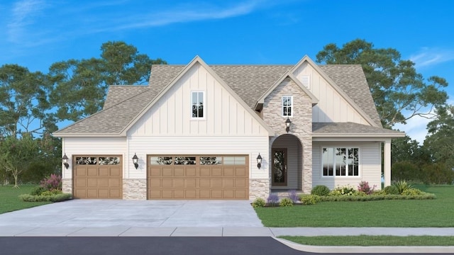 view of front facade with a front yard and a garage