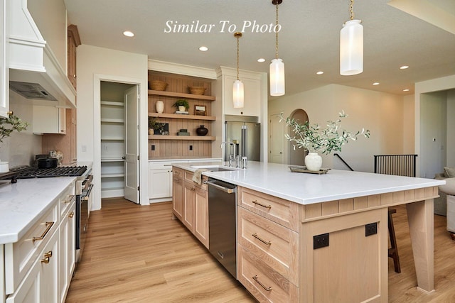 10622 NW 80th Ave, Johnston, IA 50131 - kitchen with premium range hood, stainless steel appliances, open shelves, light wood finished floors, and recessed lighting