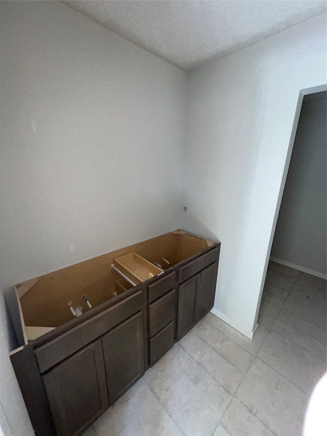 bathroom featuring a textured ceiling