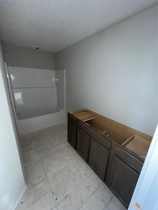 bathroom with a textured ceiling