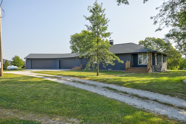 ranch-style home featuring a garage and a front yard