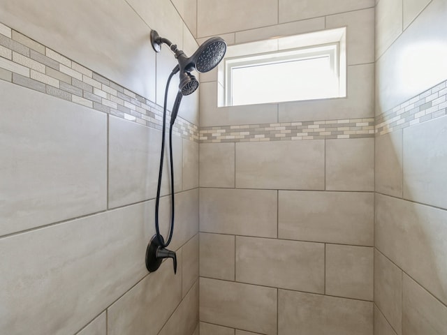 interior details with a tile shower