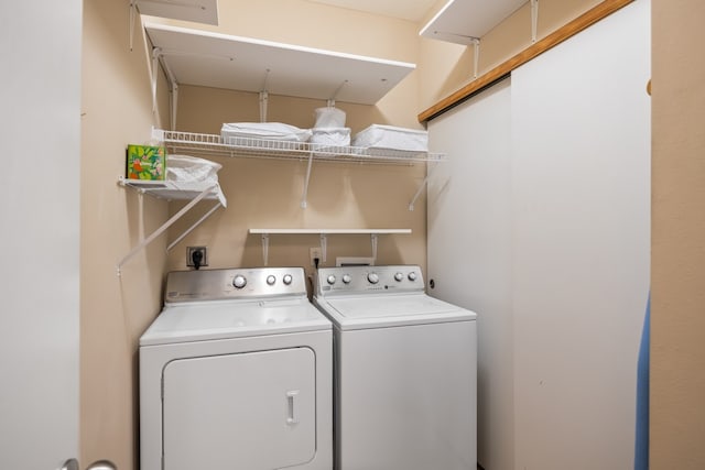 clothes washing area with laundry area and separate washer and dryer