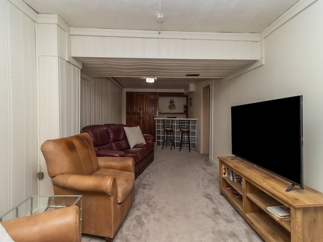 living room featuring crown molding and light colored carpet