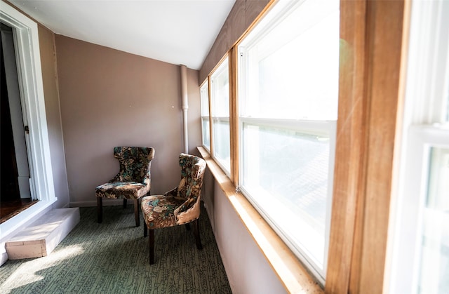 sunroom featuring lofted ceiling