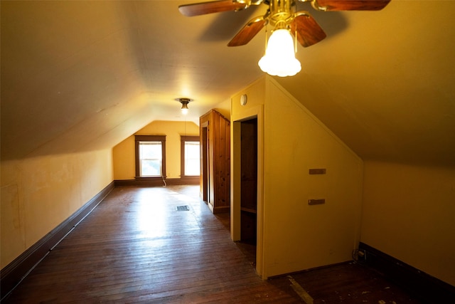 bonus room with lofted ceiling, ceiling fan, and dark hardwood / wood-style floors