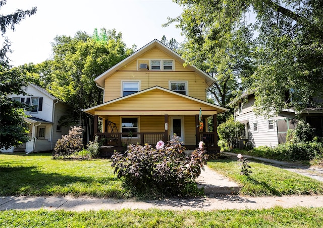 view of front of property with a front lawn and a porch