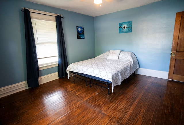 bedroom with wood-type flooring and ceiling fan