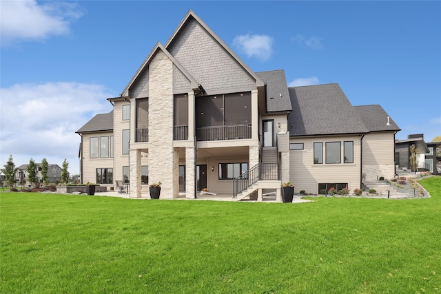 18252 Valleyview Cir, Clive, IA 50325 - back of house featuring a patio, a lawn, roof with shingles, and stairway