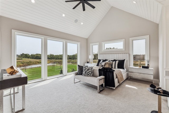 carpeted bedroom featuring ceiling fan, wood ceiling, and high vaulted ceiling