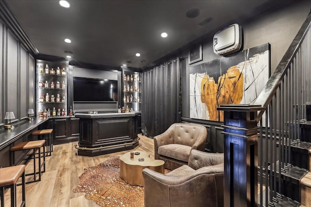 18252 Valleyview Cir, Clive, IA 50325 - home theater room with bar with sink, light wood-type flooring, an AC wall unit, ornamental molding, and recessed lighting