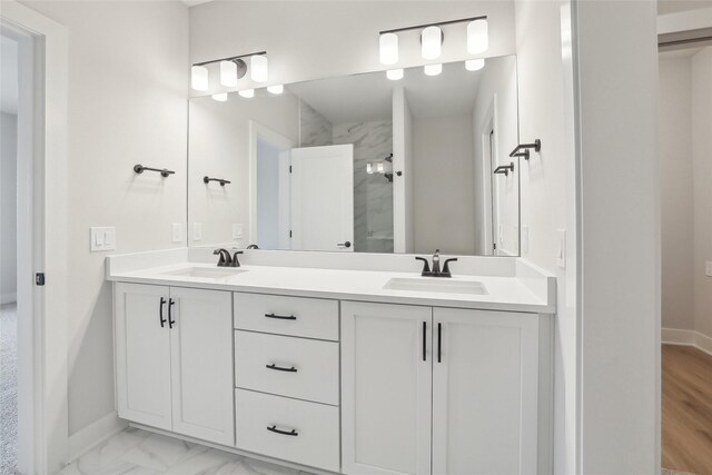 bathroom featuring vanity and a tile shower