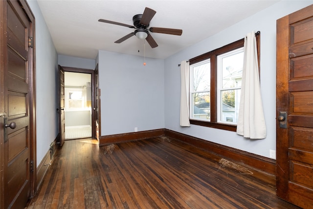 unfurnished bedroom with dark wood-type flooring and ceiling fan