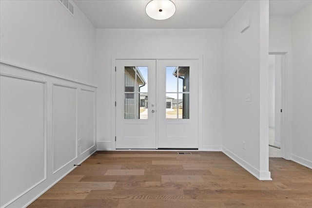 doorway to outside featuring hardwood / wood-style flooring and french doors