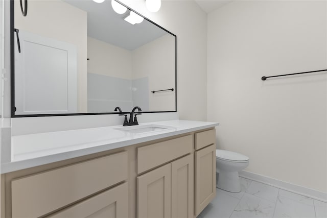 bathroom with toilet and vanity