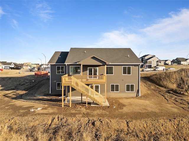 back of house featuring a wooden deck