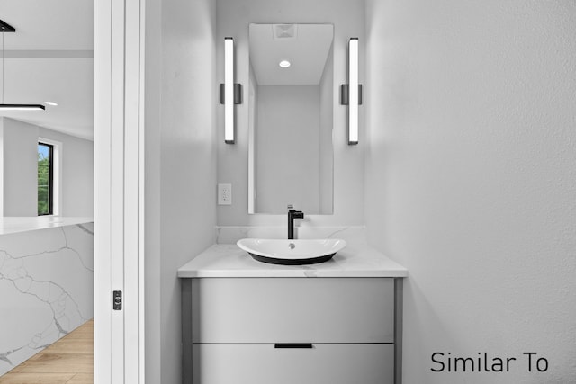 bathroom featuring vanity and hardwood / wood-style flooring