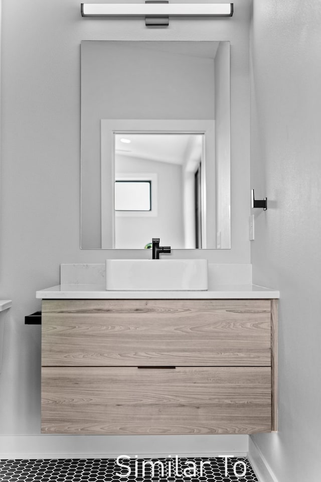 bathroom with vanity and tile patterned floors